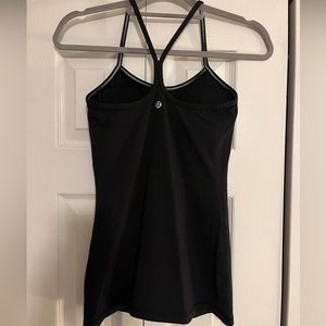 Black tank top with built in bra with pads.